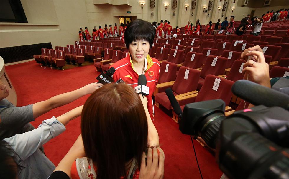 Delegação olímpica chinesa recebida em cerimônia no Grande Salão do Povo