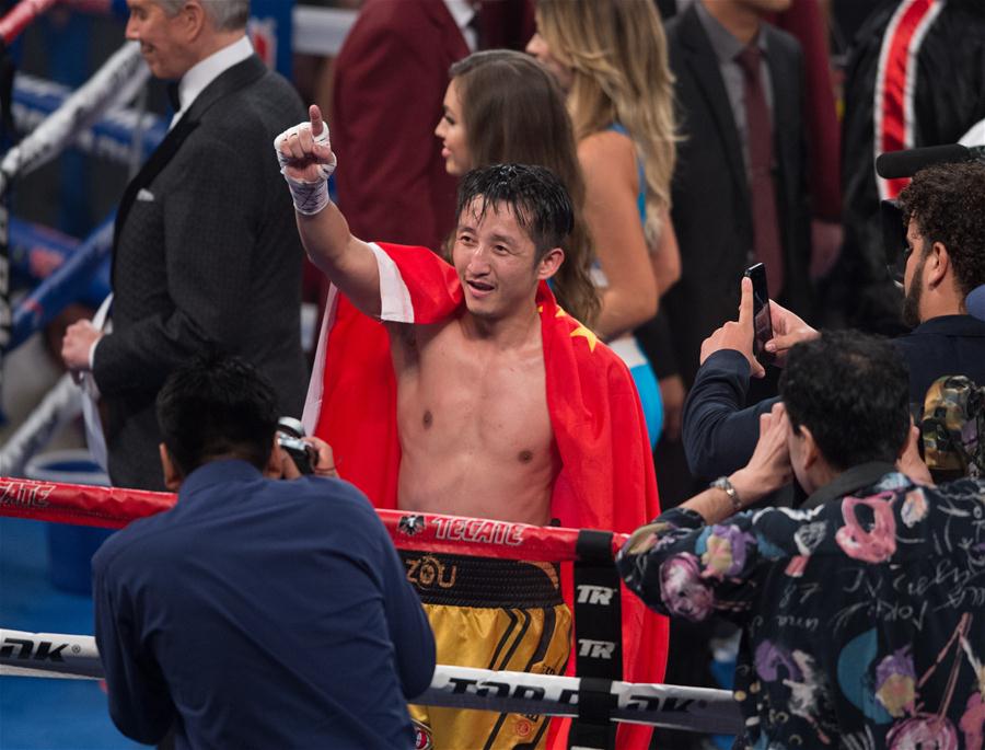 Chinês Zou Shiming é campeão mundial da categoria peso-mosca da WBO