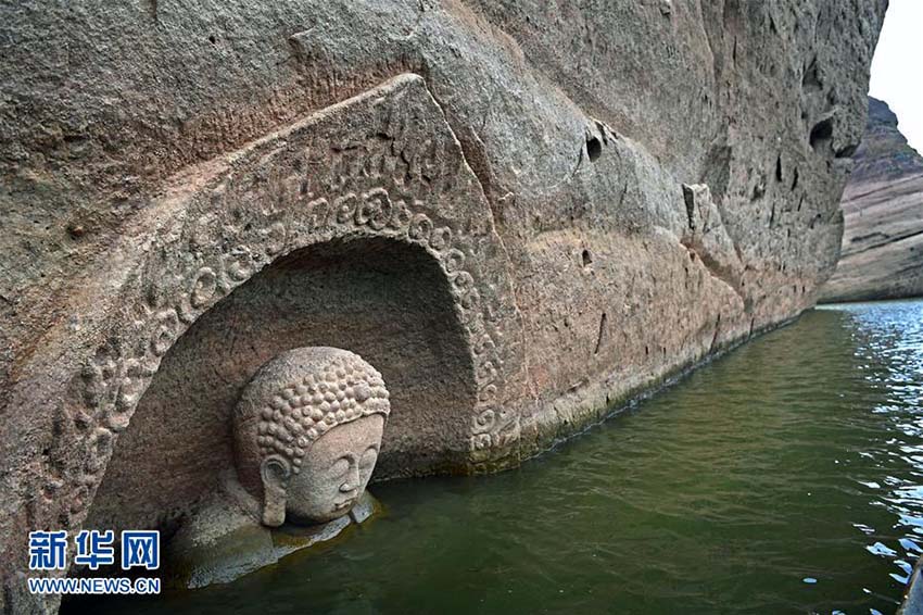 Província de Jiangxi: Buda antigo descoberto em reservatório após redução do nível de água
