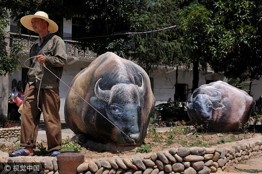Pinturas 3D transformam vila chinesa em jardim zoológico