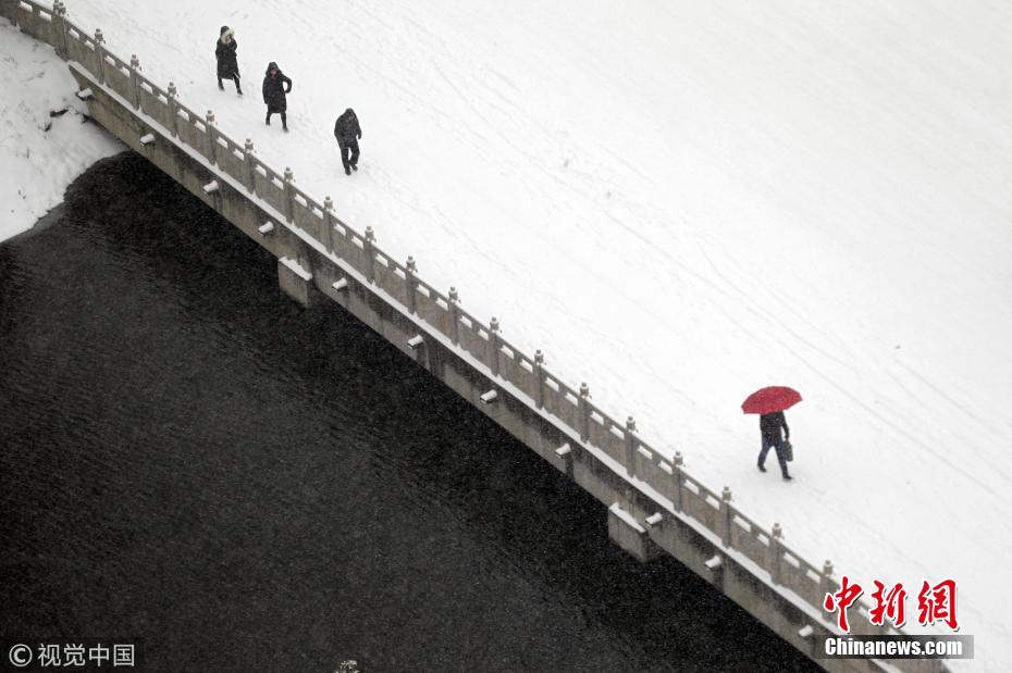 Galeria: Primeiro nevão do ano cobre de branco paisagens urbanas na China
