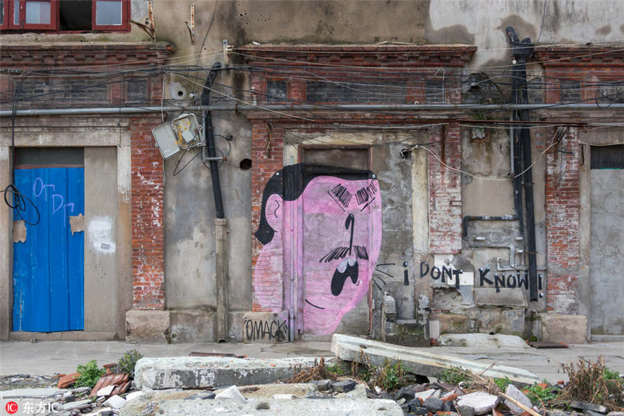 Graffitis dão nova vida a local em demolição em Shanghai