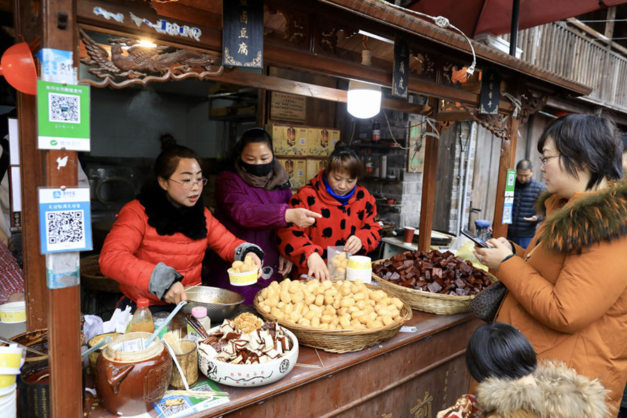 Galeria: Tradições do Ano Novo Lunar na vila antiga de Qiantong