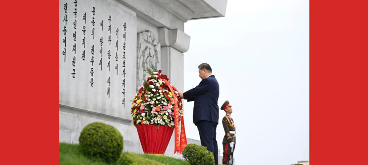 Xi e Kim comprometem-se a levar adiante a grande amizade tradicional China-RPDC através de gerações